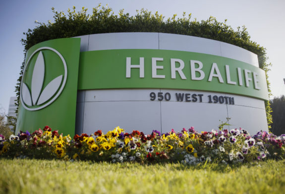 Signage stands outside of the Herbalife Ltd. Plaza in Torrance, California, U.S., on Sunday, May 1, 2016. Herbalife Ltd. is scheduled to release earnings figures on May 5. Photographer: Patrick T. Fallon/Bloomberg via Getty Images